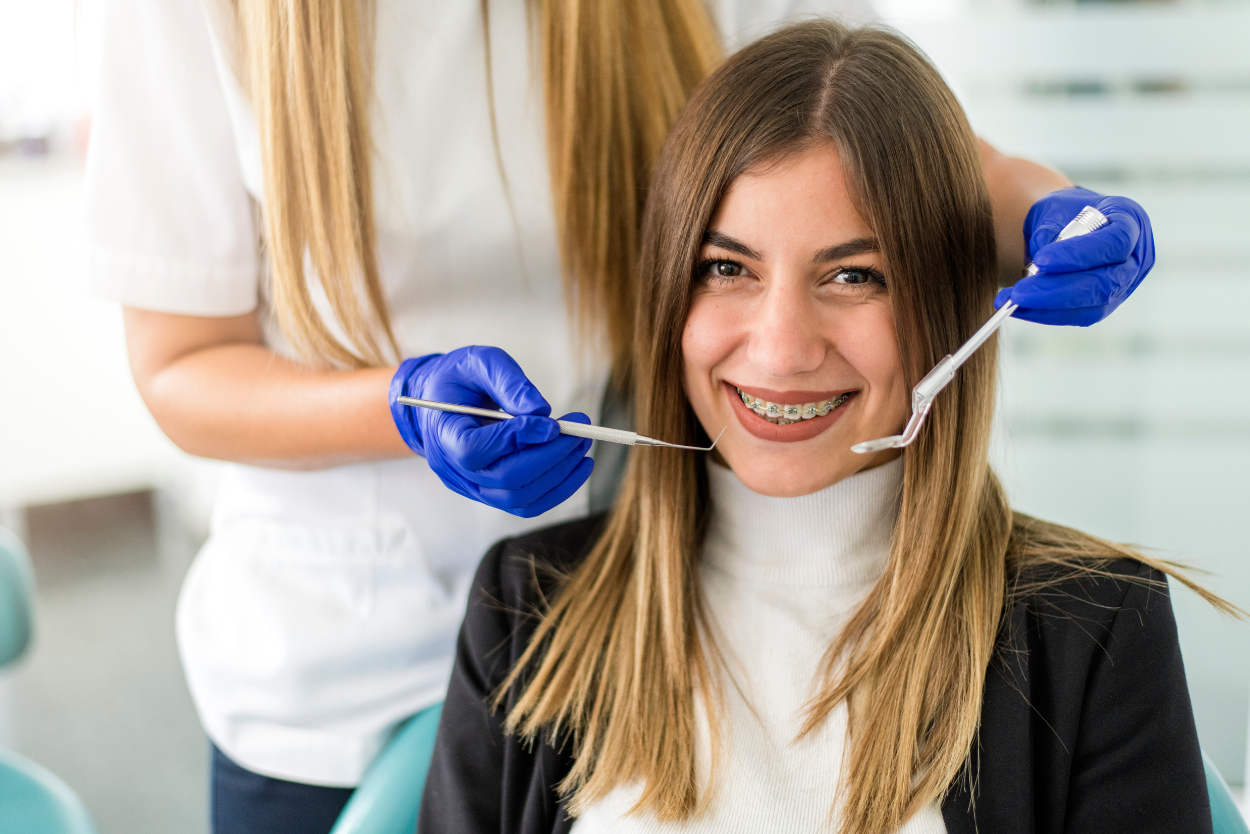 Young happy  patient a with orthodontic braces